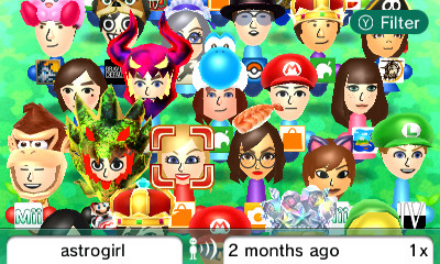 A screenshot of the Miis available in my Mii Plaza after StreetPassing at the PAX Australia event. 22 of the 61 Miis in my Plaza with various colours and headwear are in view and all of them are holding up the game they last played.