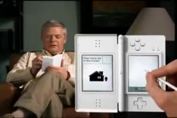 Screenshot from an old ad for Dr Kawashima’s Brain Training in which an old man sits on his couch playing the game